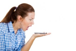 Angry, screaming woman on a cell phone